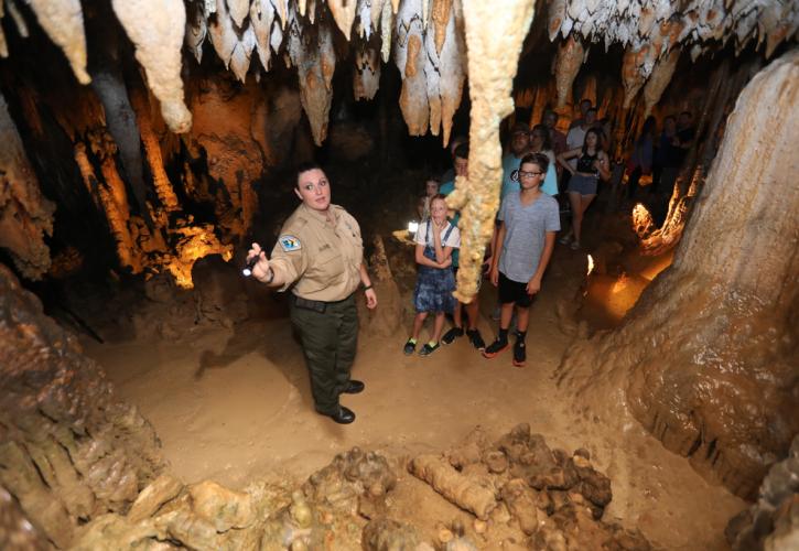 Park Ranger leading group on a tour of the Caverns. 