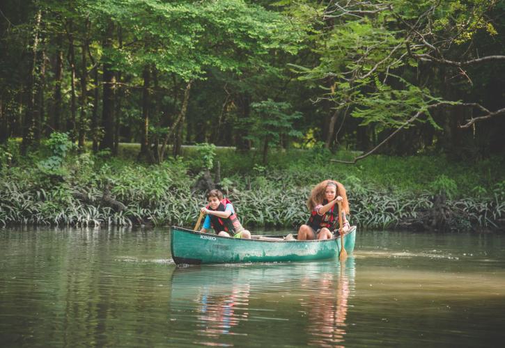Two children canoeing