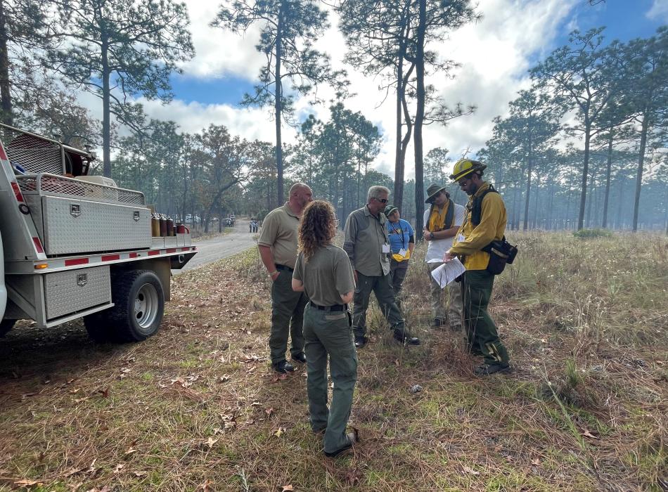 Alexa talks with the team during a prescribed fire.