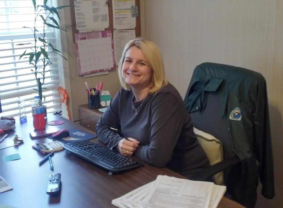 Administrative Assistant Leanne Chandler sits at her desk ready to tackle the days work. 