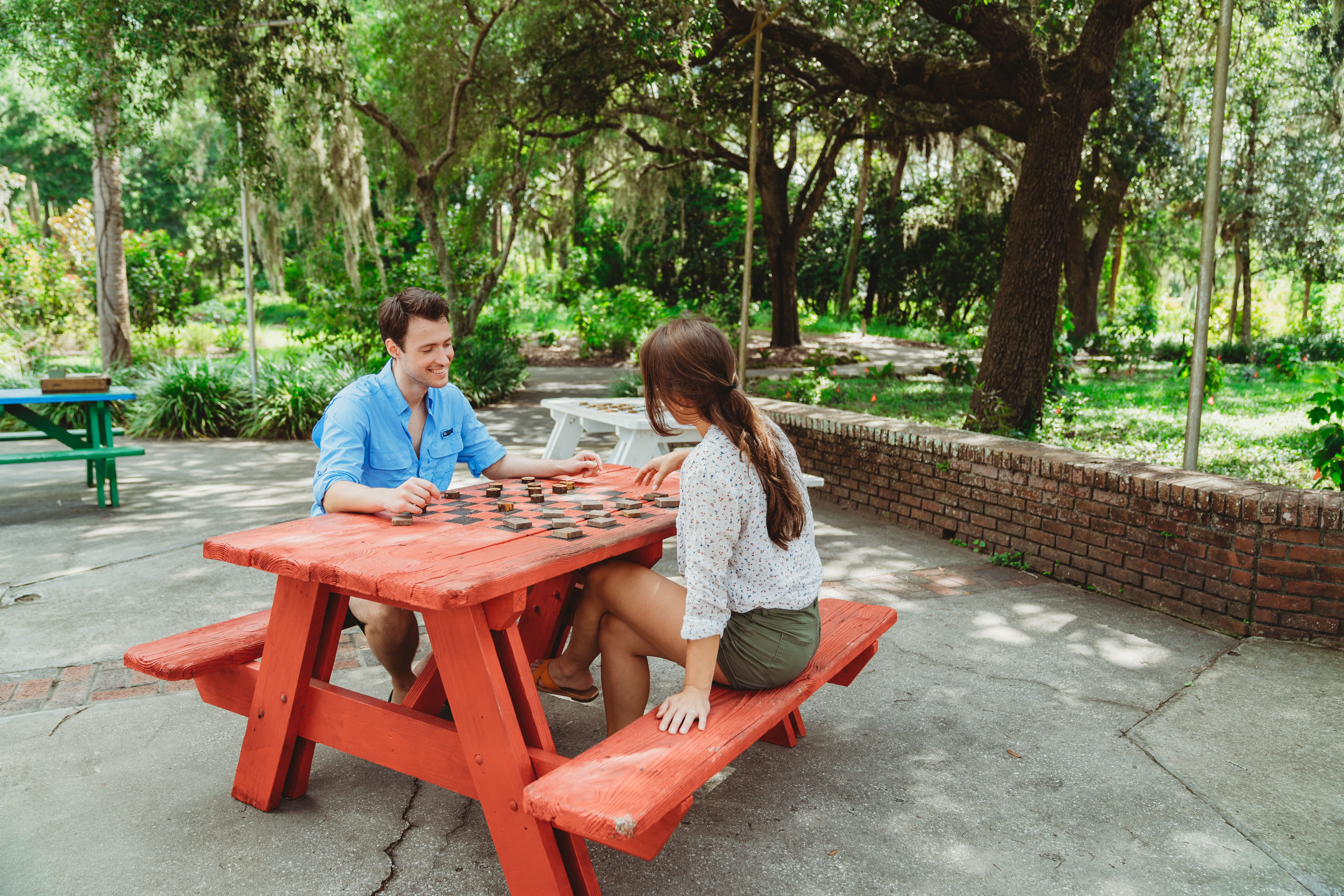 Two visitors use a picnic table in Silver Springs State Park. 