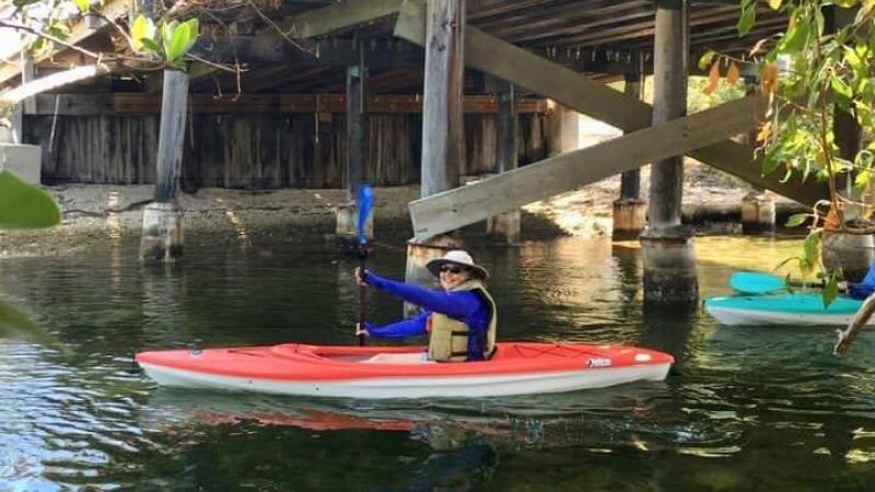 Cathy Thurow paddles under a bridge in the Florida Keys.