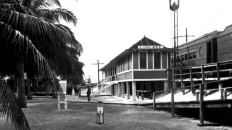 A black and white photo of the old railroad depot.