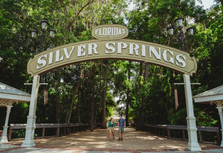 Two visitors walking through the Silver Springs Entrance