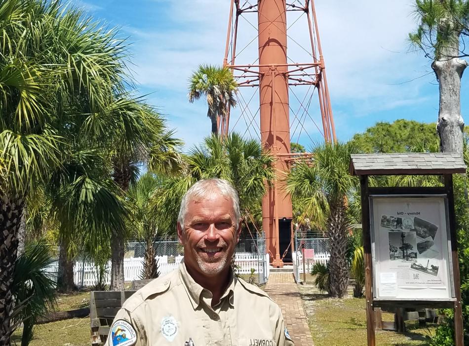 Tod Cornell standing in front of the lighthouse.