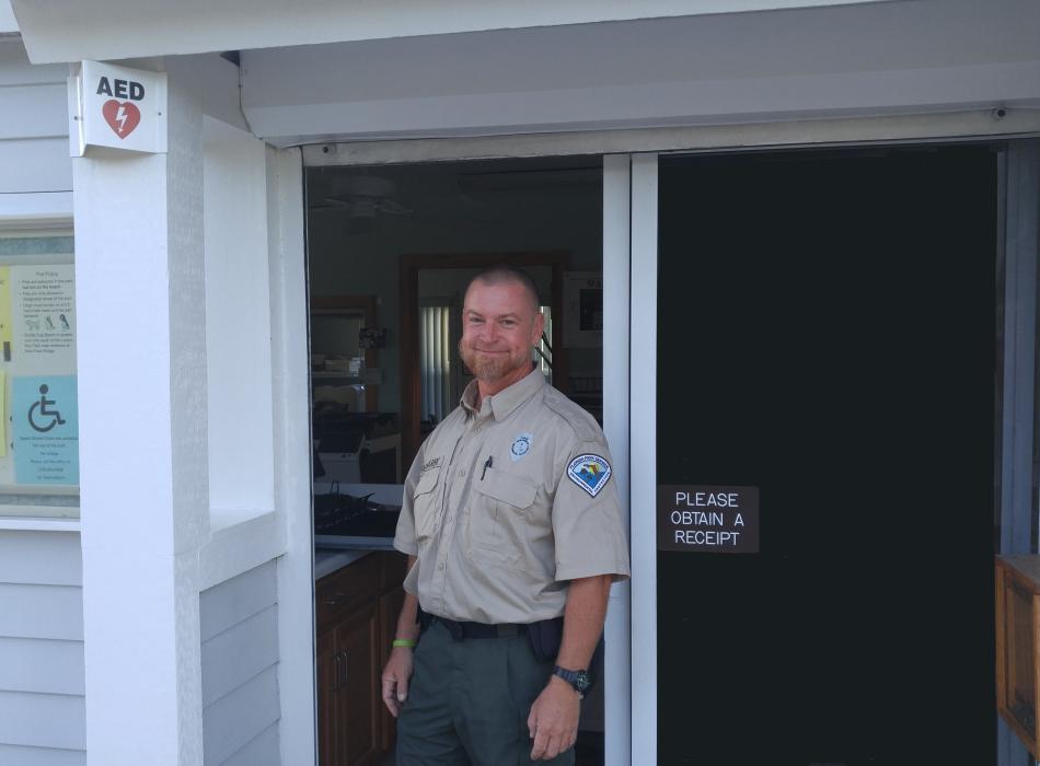 Bryan, standing in the doorway of the ranger station.