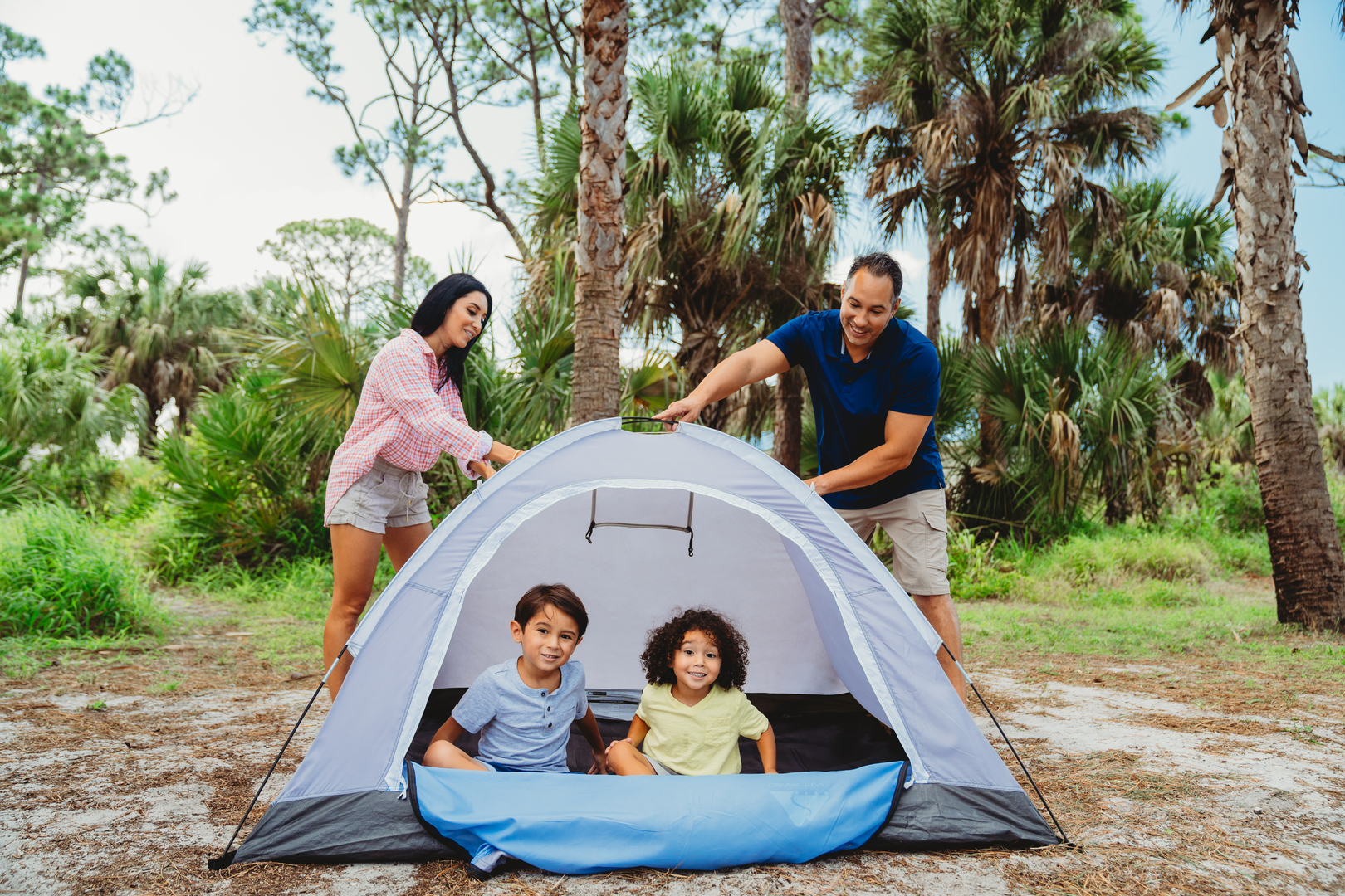 Family camping in a tent