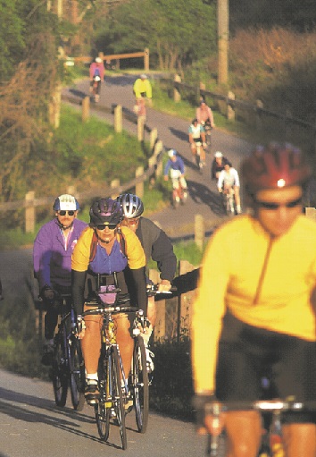 Cyclists riding on big sink hill