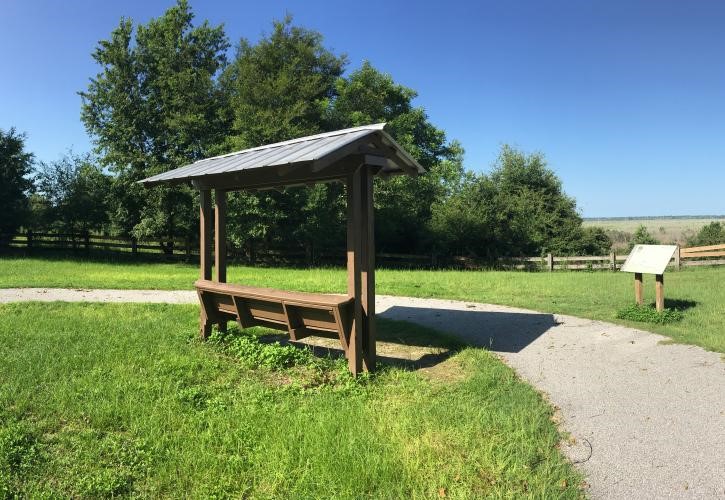 Covered bench and interpretive panel at Sweetwater Overlook