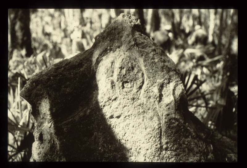 a piece of limestone with markings resembling a human figure.