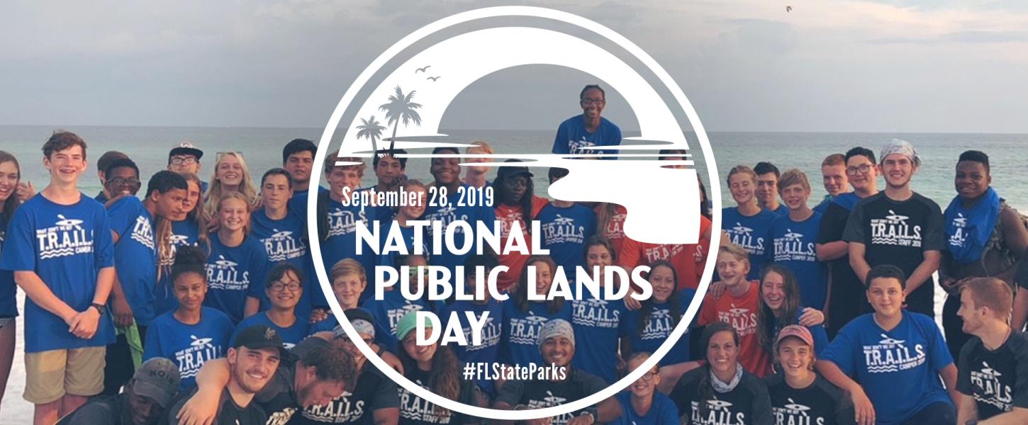 National Public Lands Day logo over picture of group of cleanup volunteers. 
