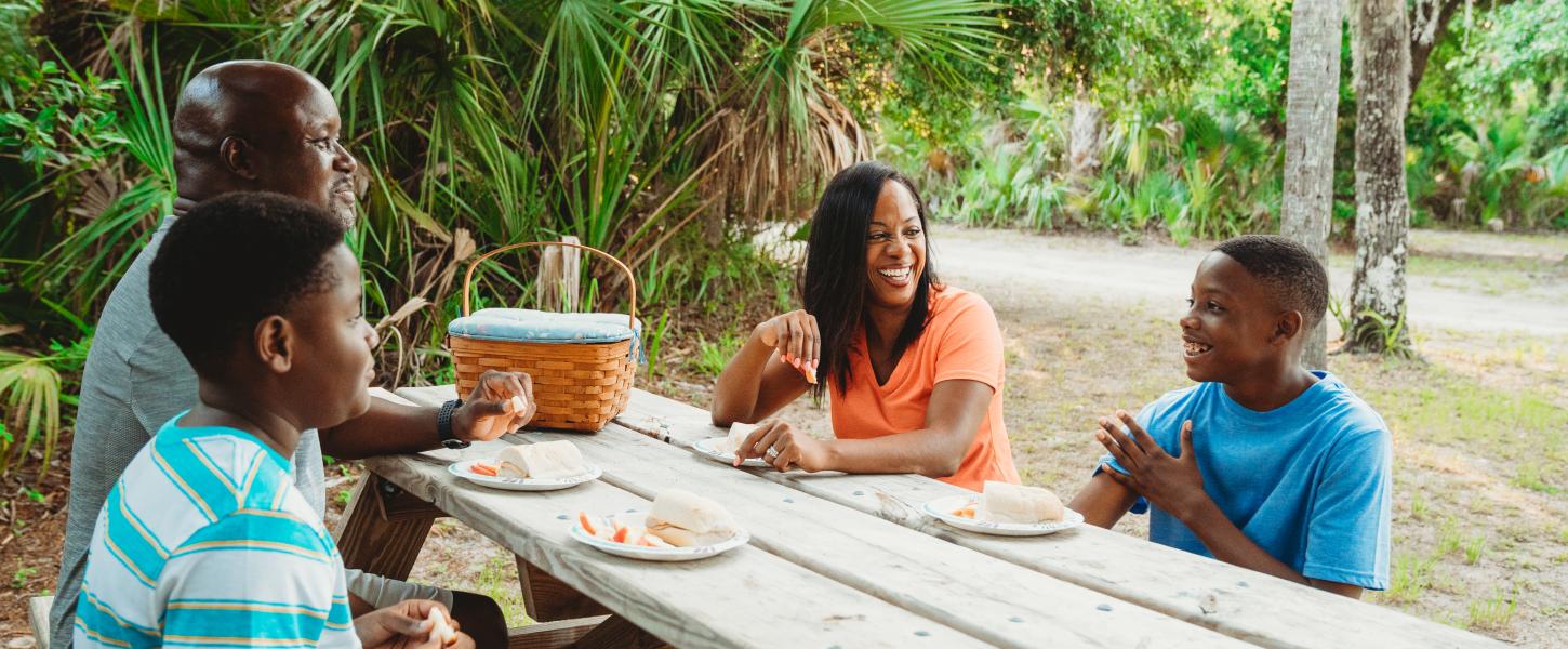 A family has a picnic at Tomoka State Park. 