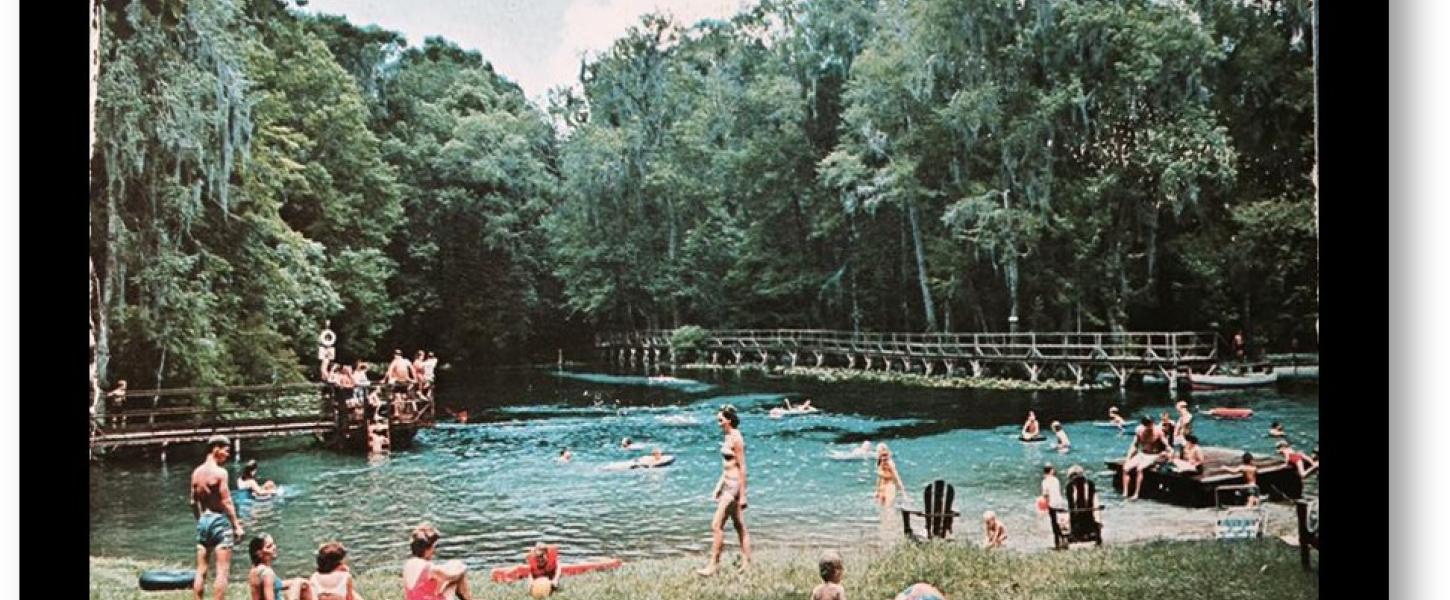 A 1960s image of Gilchrist Blue with people swimming and on shore. 