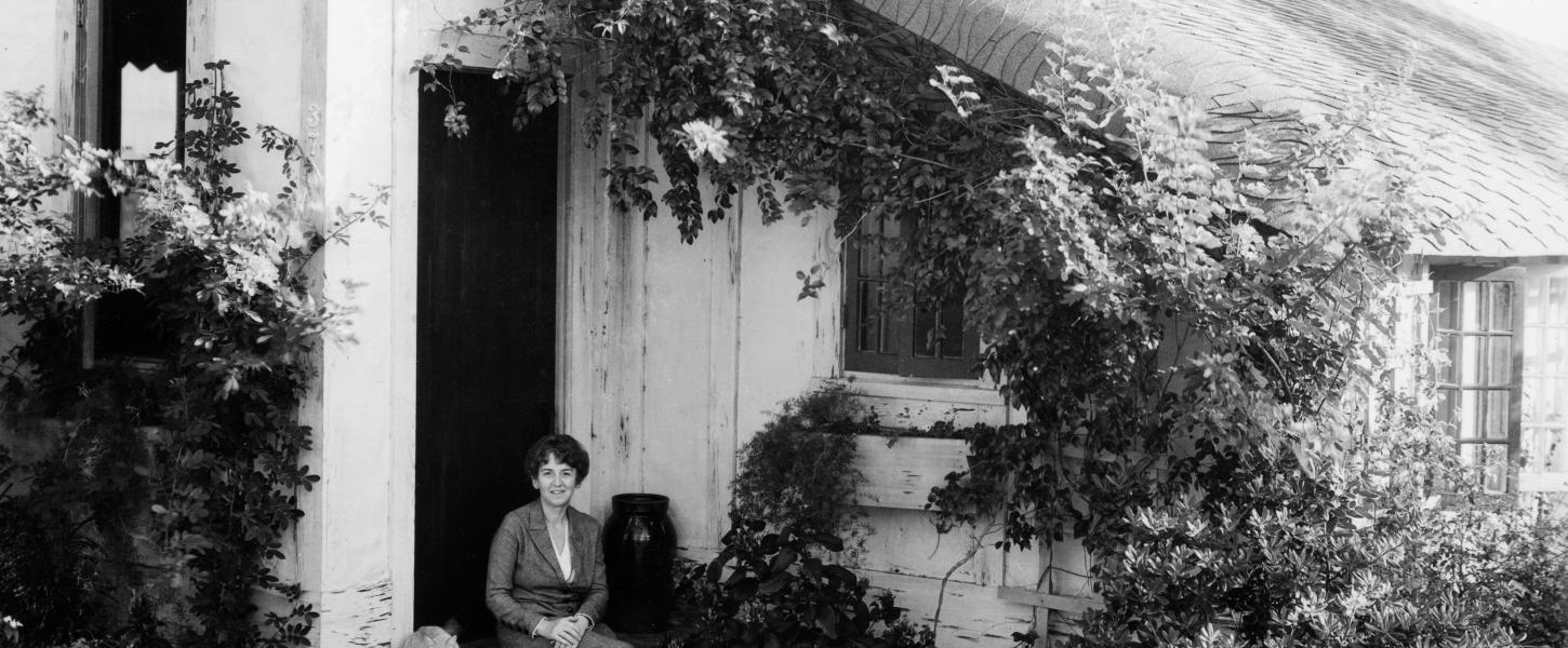 Marjory Stoneman Douglas sits on the steps of her home.