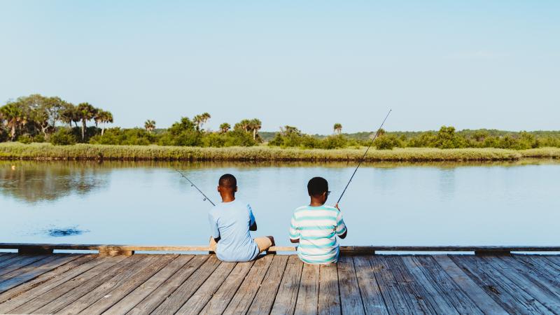 Two boys fishing at Tomoka State Park
