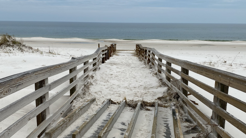 The boardwalk near the fire station sustained damage and was covered by sand.  