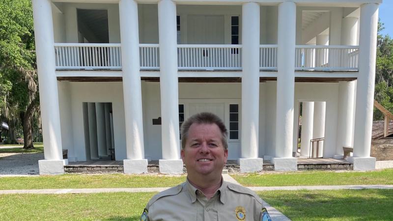 Kevin Kiser stands in front of the Gamble Mansion.