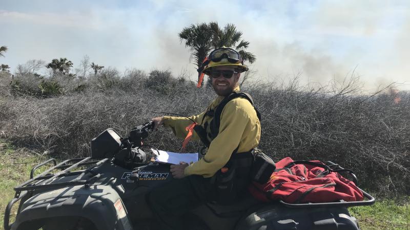Chris on an ATV on the fire line 
