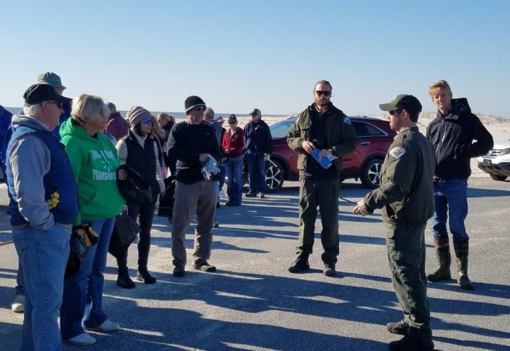 Park staff welcome group of volunteers assisting with beach cleanup efforts after Hurricane Michael. 