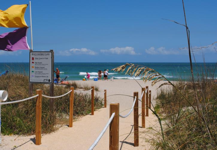 A view of the sandy walkway leading to the beach.