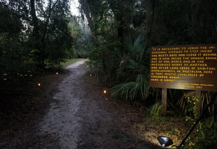 candles light a path and sign