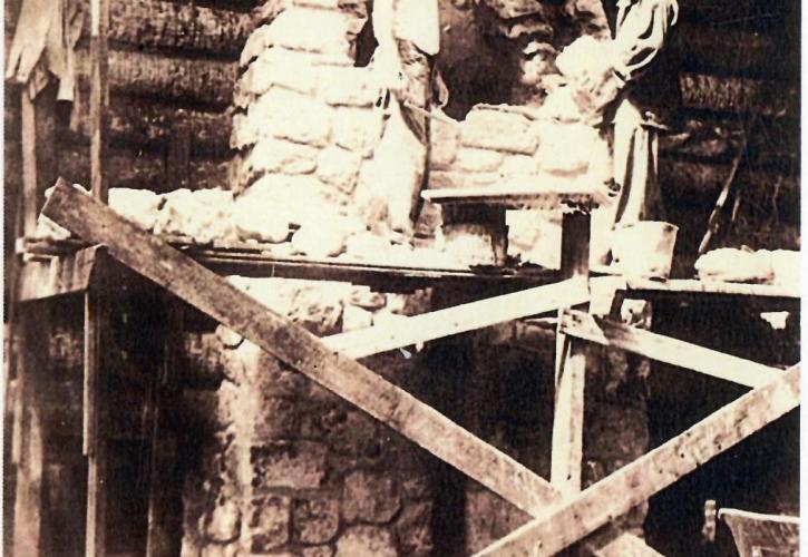 Two CCC enrollees work on building the Log Pavilion