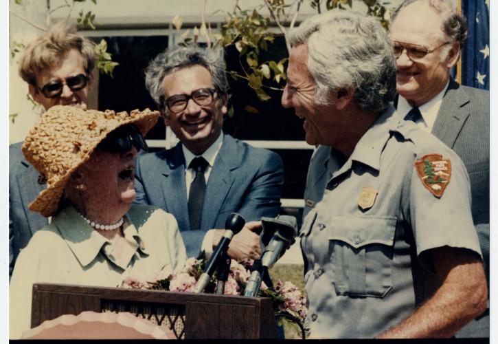 Marjorie Stoneman Douglas stands at a podium at the Everglades dedication ceremony, 1982. Courtesy of the State Archives of Florida.