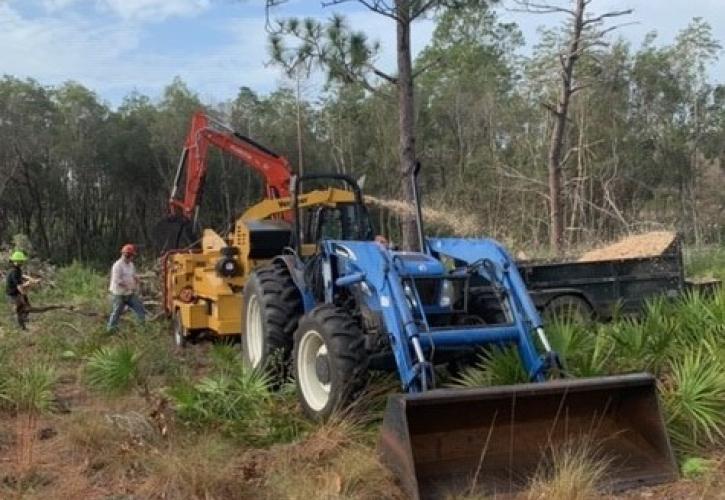 Tractor used to chip titi