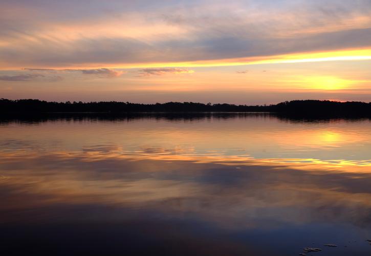 Sky pinks, yellows, and oranges over Rocky Bayou. 