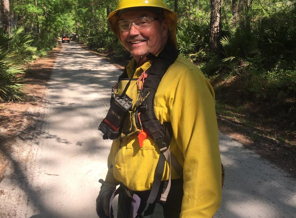 Park Ranger Billy Harrison prepares for a prescribed fire.