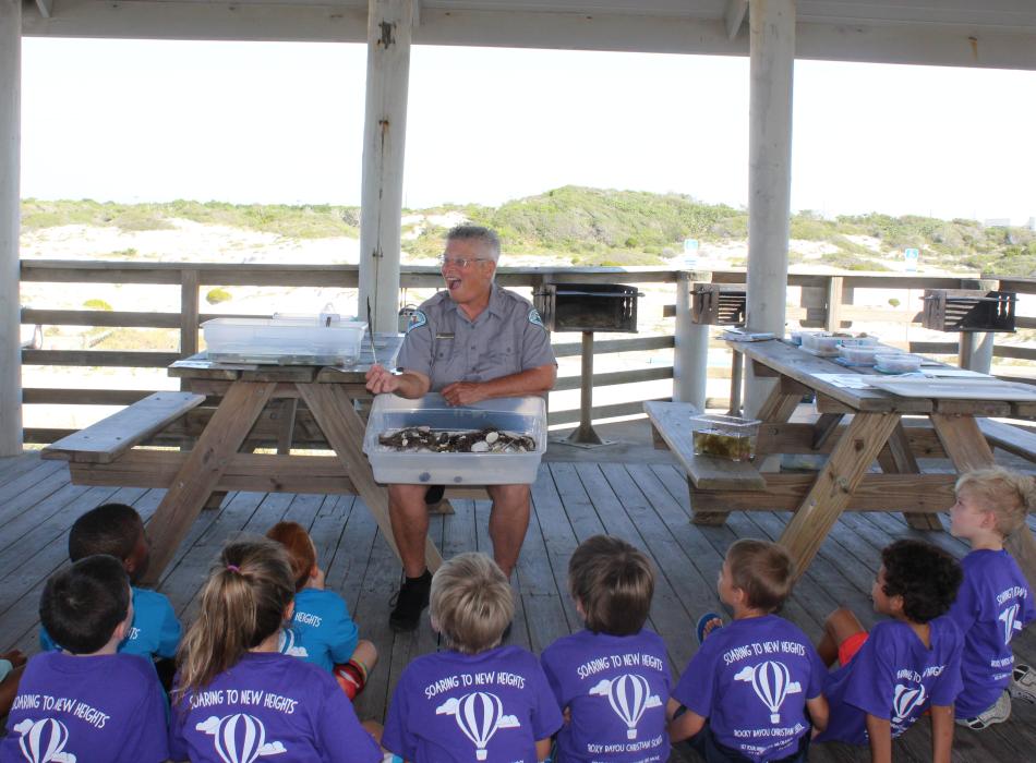 Doe, doing an educational presentation for a group of children.