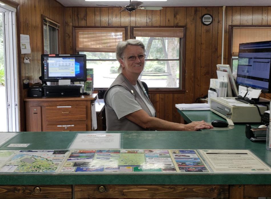 image of linda eldridge, volunteer at manatee springs state park, in the ranger station.