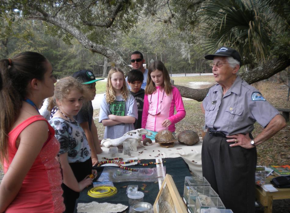 Myra interpreting to some visitors.