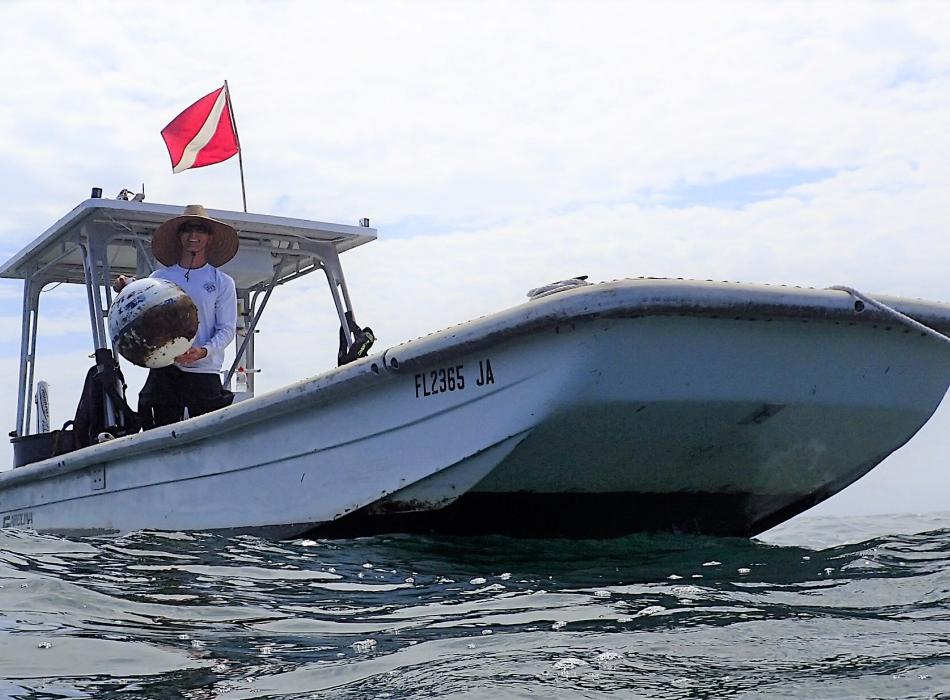 volunteer Nate Collins helping with Buoy work